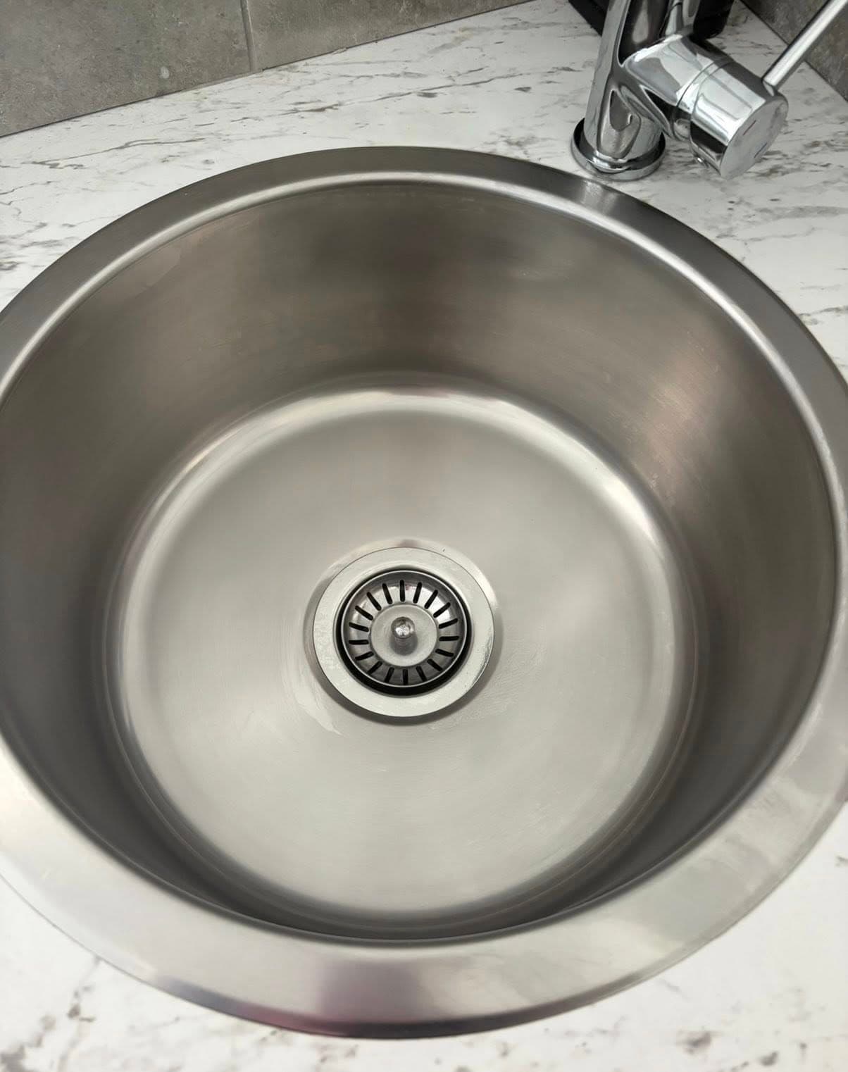 Pristine kitchen sink after cleaning